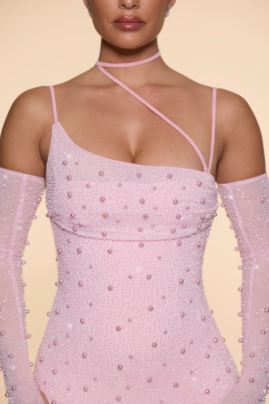 koristeltu epäsymmetrinen korsettiminimekko värissä blush